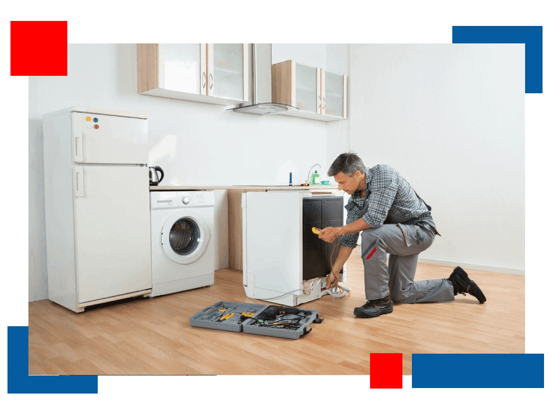 A man is fixing the dishwasher in his kitchen.