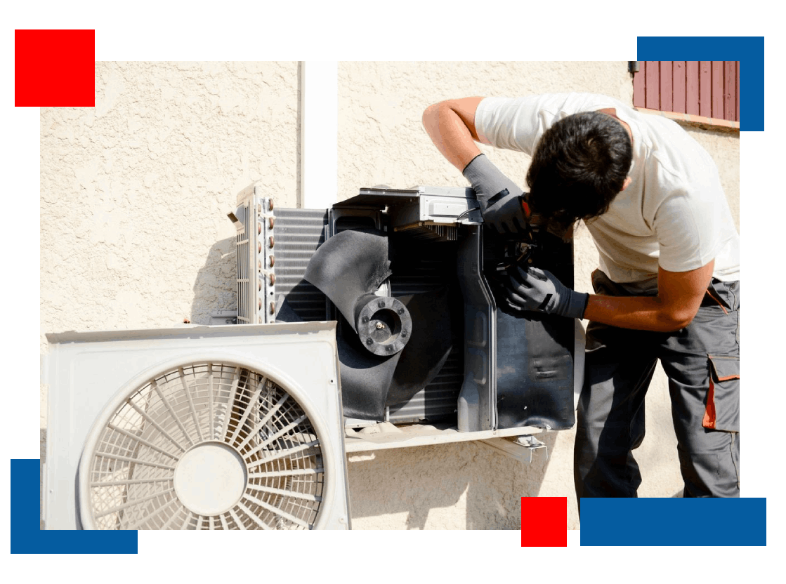 A man working on an air conditioner outside.